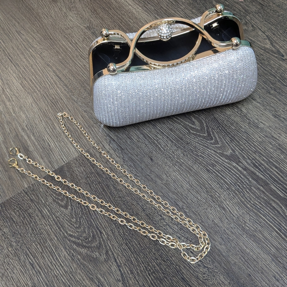 Elegant Silver Clutch with Gold Chain